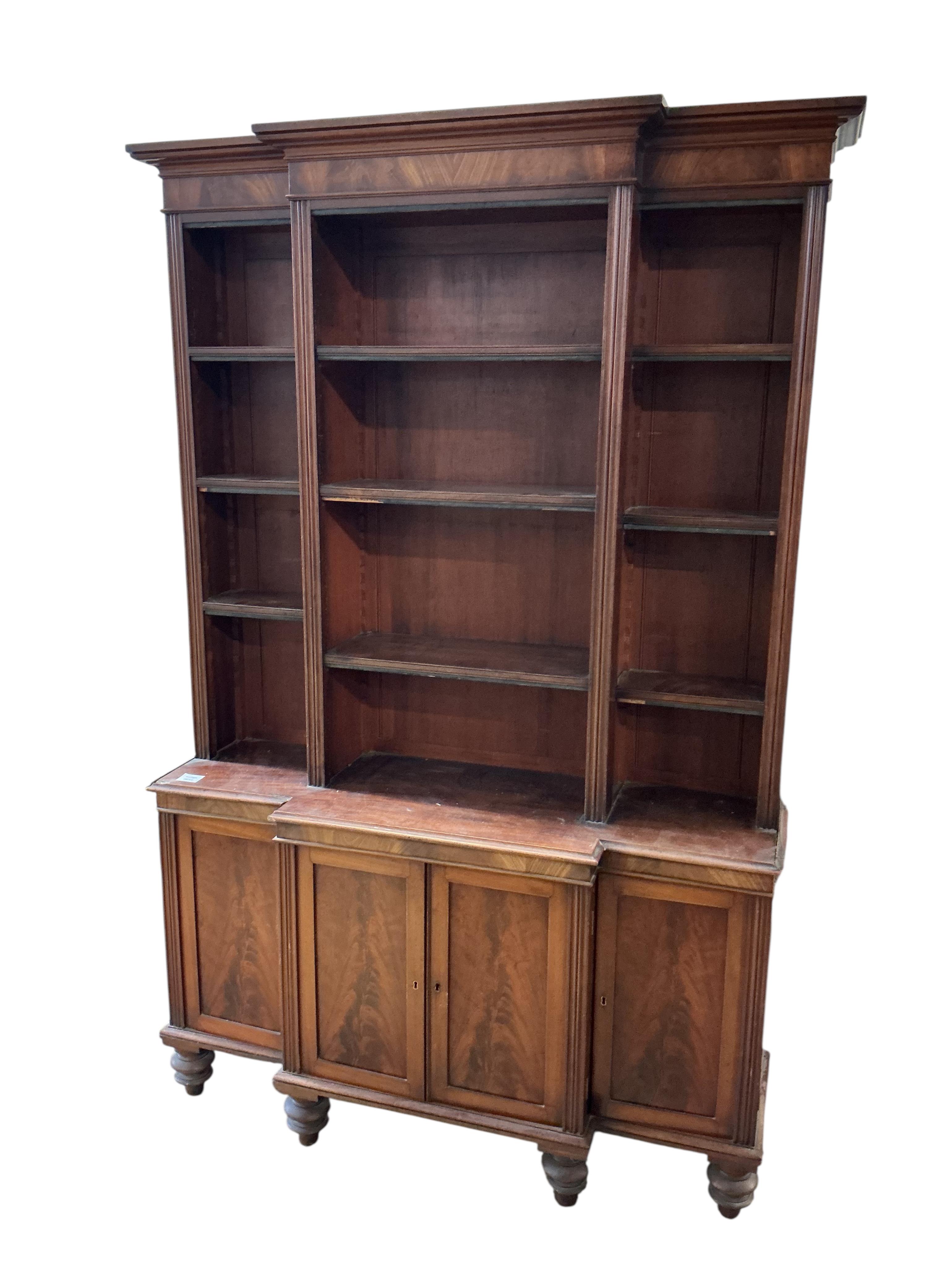 A small George IV style mahogany breakfront bookcase / cupboard, width 110cm, depth 30cm, height 172cm